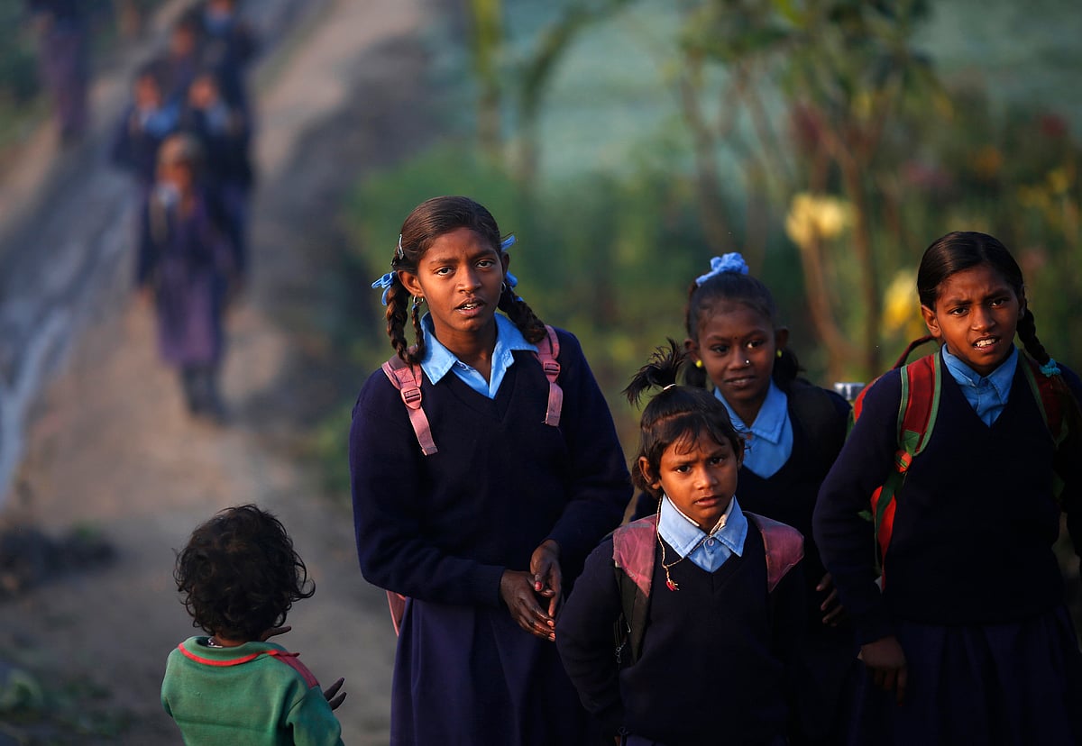 <div class="paragraphs"><p>Schoolgirls make their way to their school [REUTERS/Ahmad Masood]</p></div>