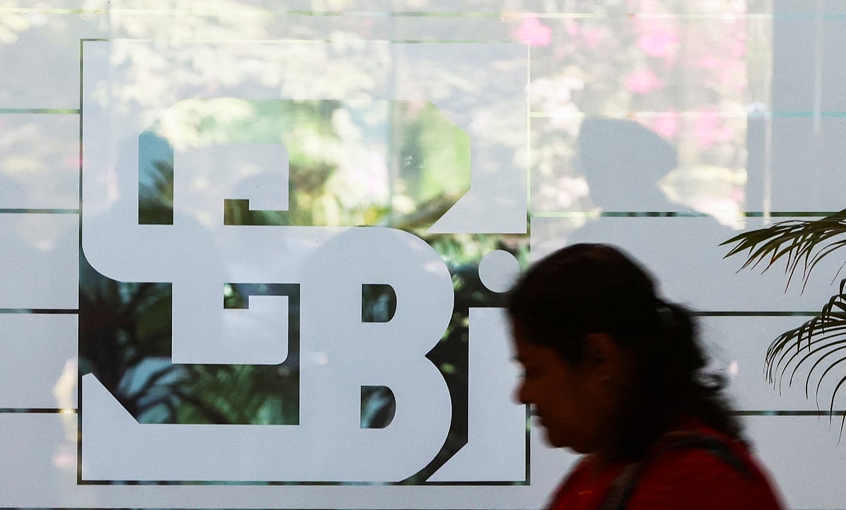 <div class="paragraphs"><p>A woman walks past the SEBI headquarters in Mumbai. (Photograph: Francis Mascarenhas/Reuters)</p></div>