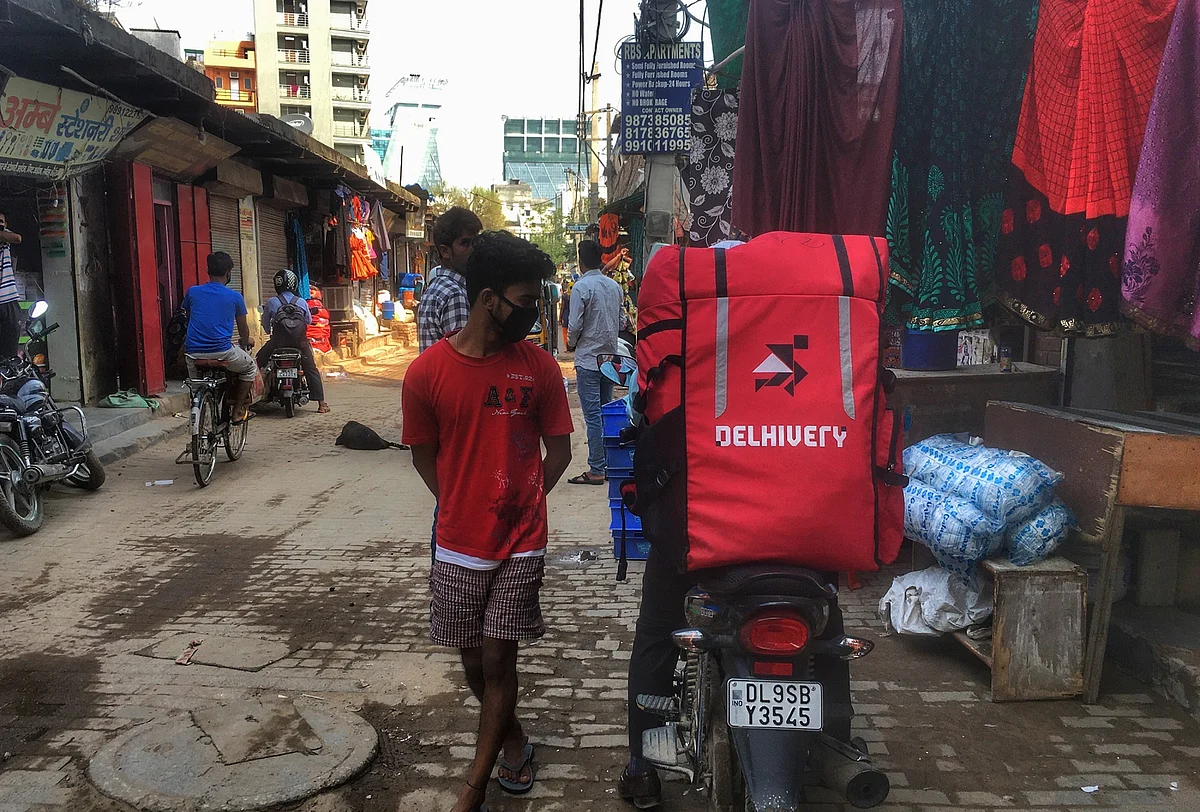 A Delhivery rider with orders in Gurugram, India. Photographer: Nasir Kachroo/NurPhoto/Getty Images