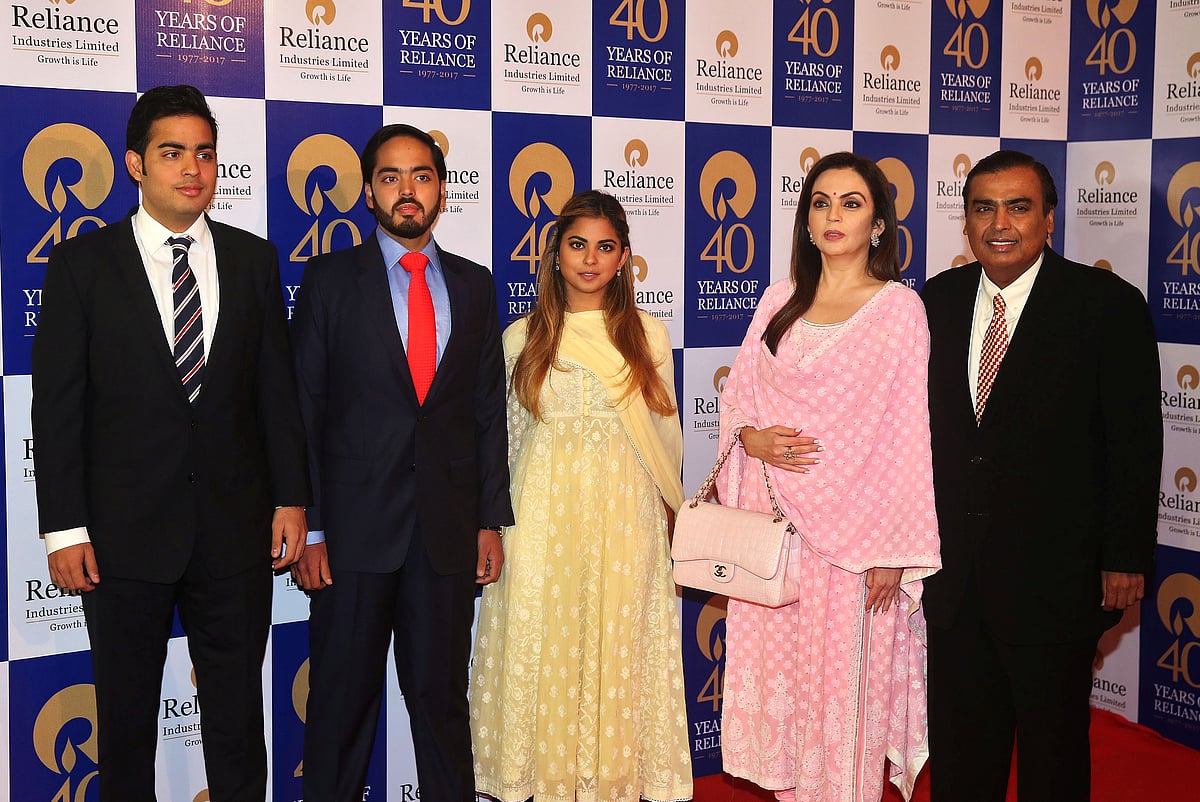 <div class="paragraphs"><p>Mukesh Ambani poses with his family before addressing the Reliance Industries Ltd. annual general meeting in Mumbai. (Source: Reuters/Shailesh Andrade)</p></div>