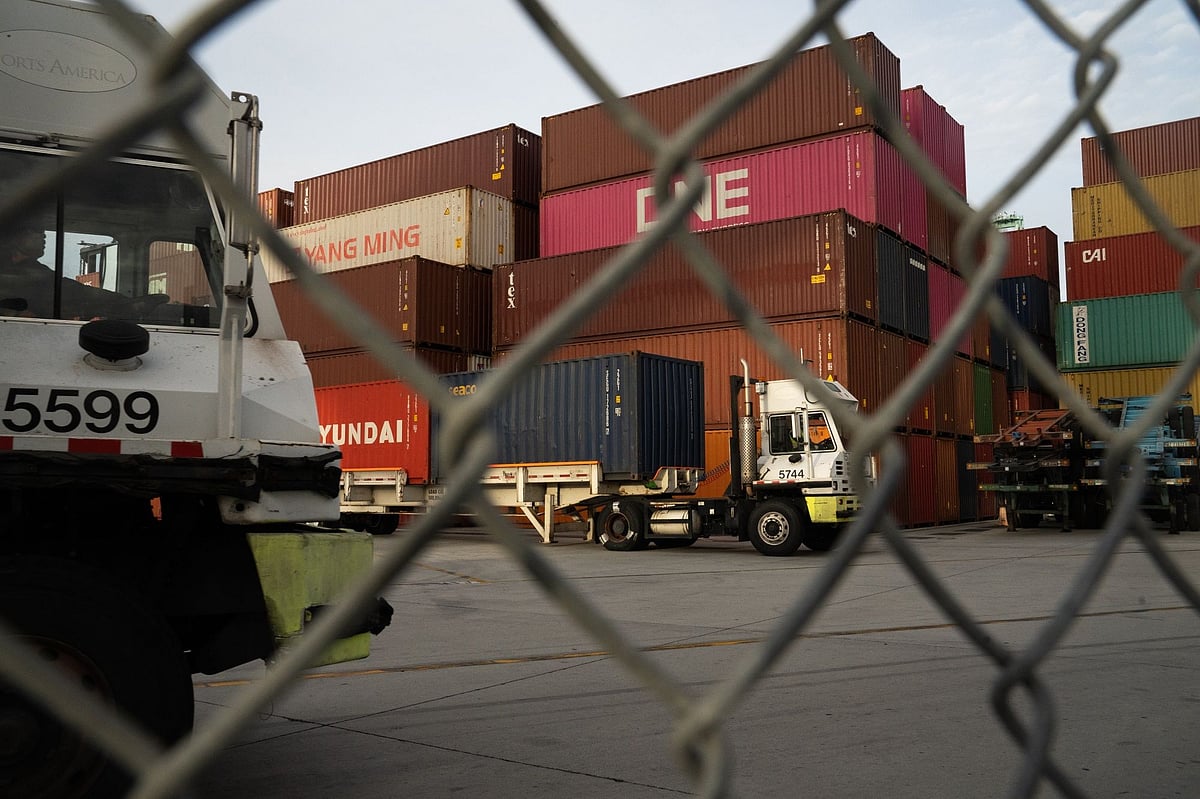 <div class="paragraphs"><p>Trucks pull shipping containers through the West Basin Container Terminal at the Port of Los Angeles in San Pedro, California, U.S., on Friday, Nov. 20, 2020. </p></div>