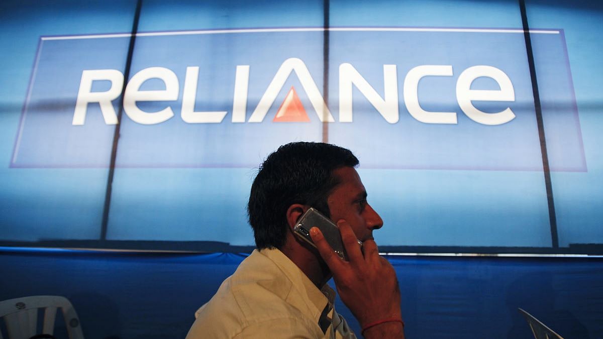 <div class="paragraphs"><p>A shareholder speaks on a mobile phone while attending the AGM of Reliance Capital in Mumbai. (Source: Reuters)</p></div>