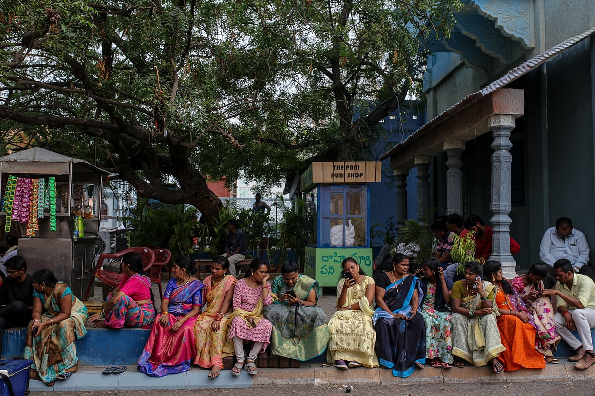 Film extras take a break from shooting at the Ramoji Film City.Photographer: Dhiraj Singh/Bloomberg