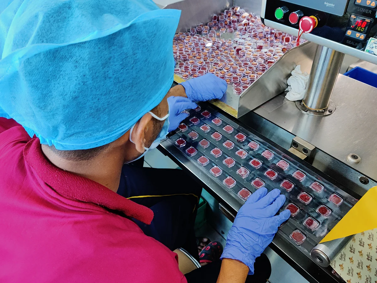 <div class="paragraphs"><p>A worker blistering the packages to protect it from moisture, rain during transit. (Source: BQ Prime)</p></div>