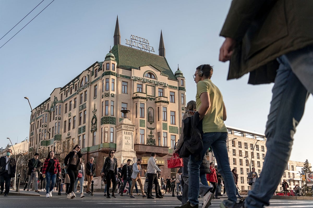 A busy pedestrian crossing outside the Hotel Moskva in March. Photographer: Oliver Bunic/Bloomberg
