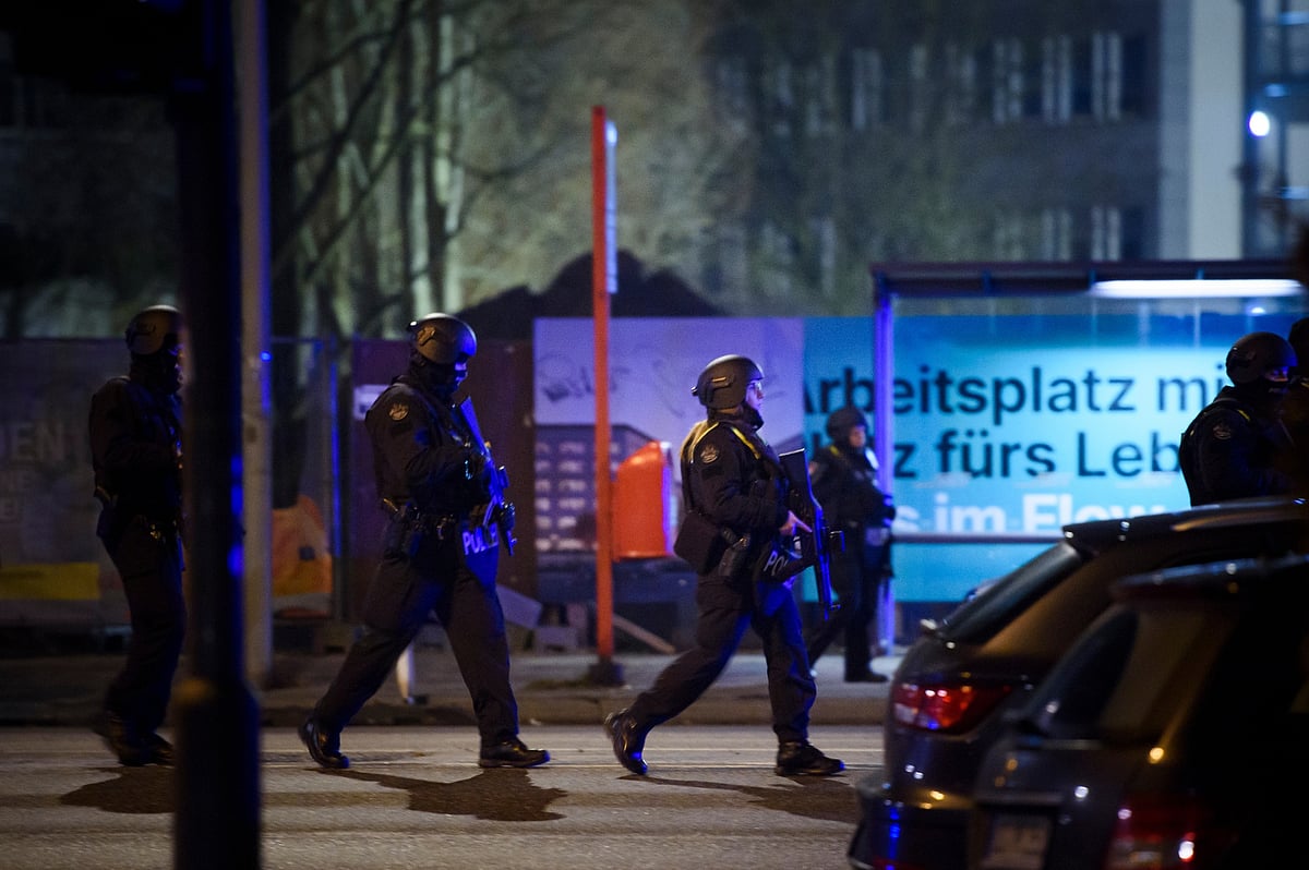 Police officers at the scene of a shooting in Alsterdorf district, Hamburg, on March 9. Photographer: Gregor Fischer/Getty Images  