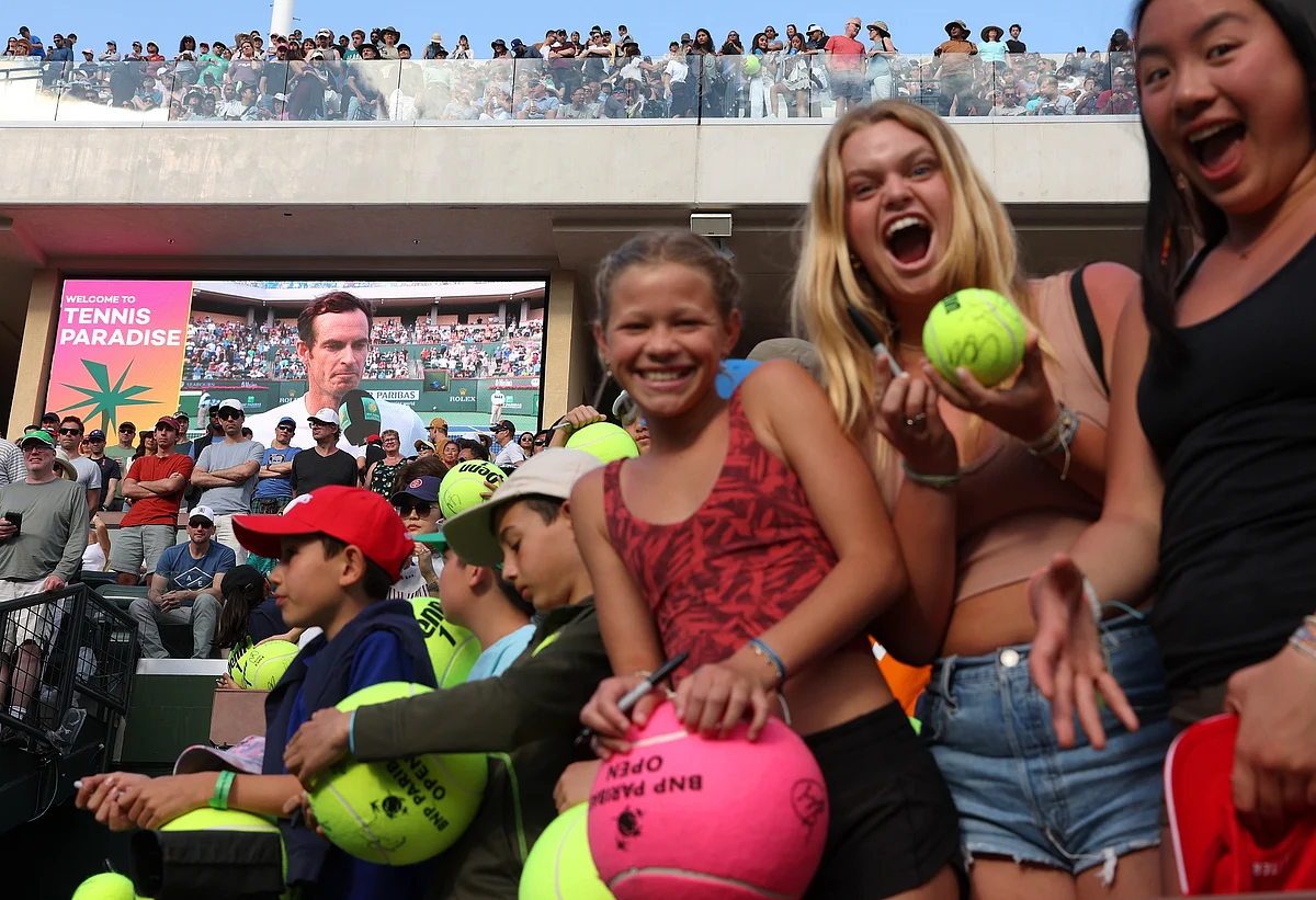 Fans show off their signed tennis balls during the BNP Paribas Open on March 11.Photographer: Julian Finney/Getty Images