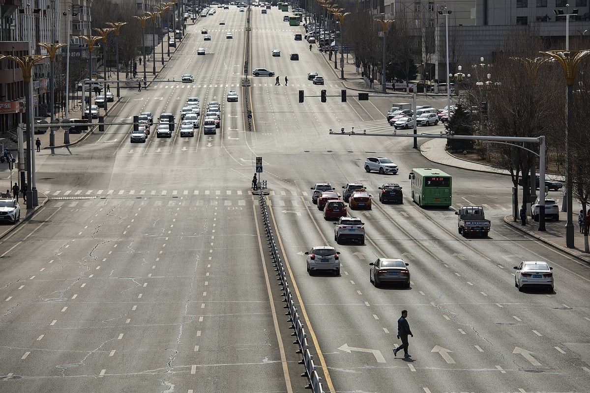 A ten-lane road through the center of town. There are concerns that local governments will have to make painful spending cuts or divert money away from growth-boosting projects to continue repaying their debt.Photographer: Qilai Shen/Bloomberg