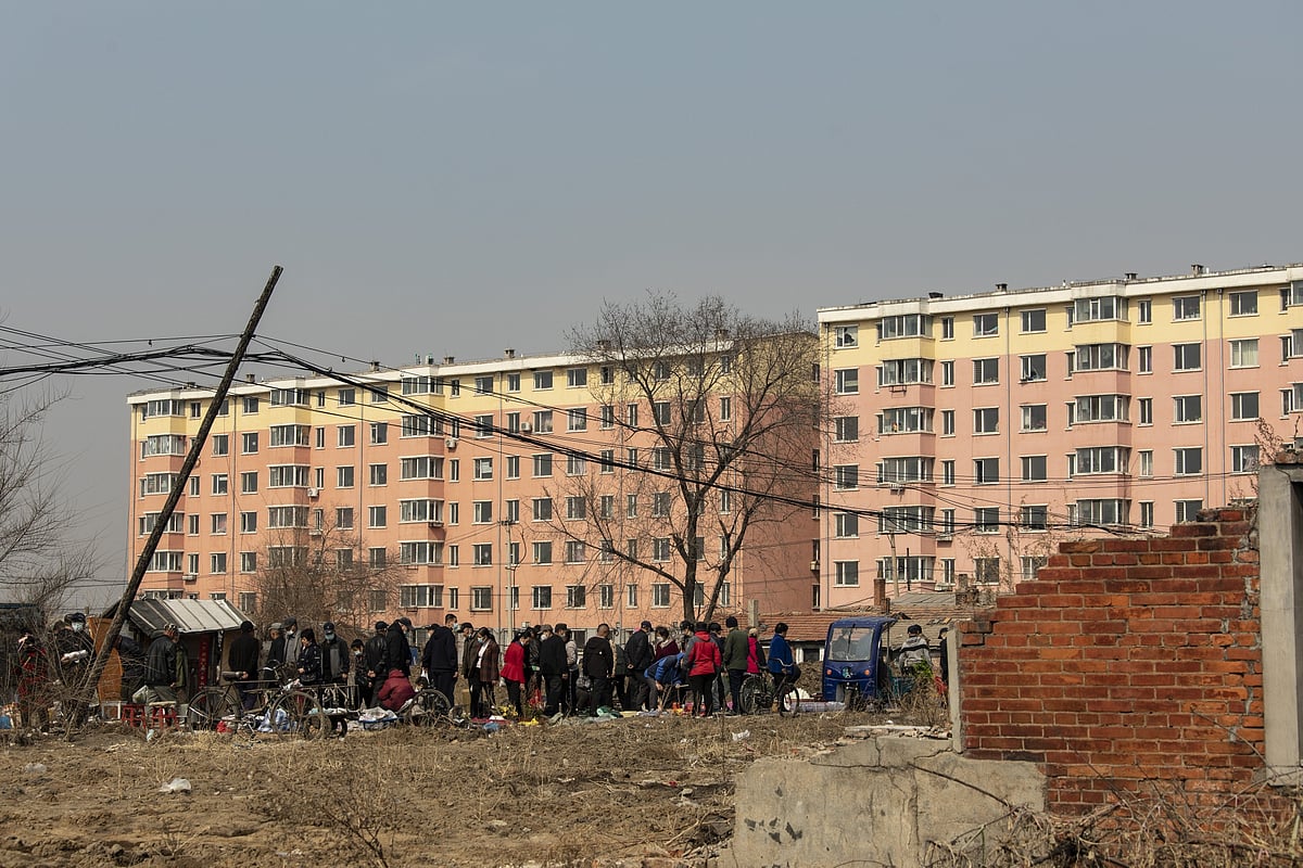 Locals shop at a Sunday market. President Xi has the ambition of doubling income levels by 2035 while reducing the gap between rich and poor.Photographer: Qilai Shen/Bloomberg