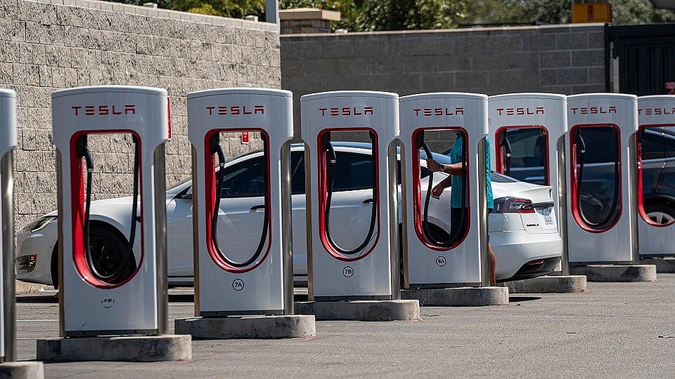General Motors Co. is adapting its electric vehicles to Tesla Inc.’s Superchargers, gaining access to a network of 12,000 chargers and all but ensuring it will become an industry standard in the US. William Wilkes reports on Bloomberg Television.Source: Bloomberg