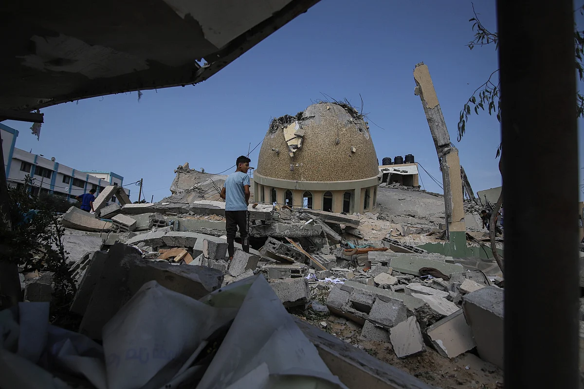 A boy at the site of a destroyed mosque following an Israeli airstrike in Khan Younis, Gaza Strip, on Sunday.Photographer: Ahmad Salem/Bloomberg