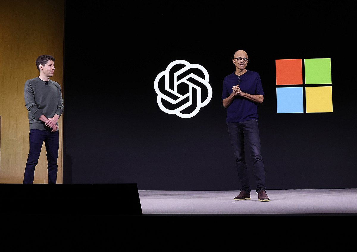 Satya Nadella, right, speaks on stage with Sam Altman during the OpenAI DevDay event on Nov. 6.Photographer: Justin Sullivan/Getty Images