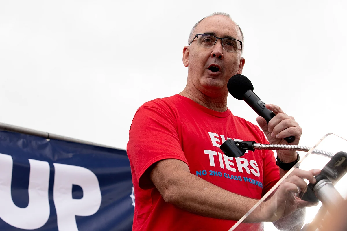 UAW President Shawn Fain speaks to the crowd during a rally in Detroit on Sept. 15.Photographer: Emily Elconin/Bloomberg