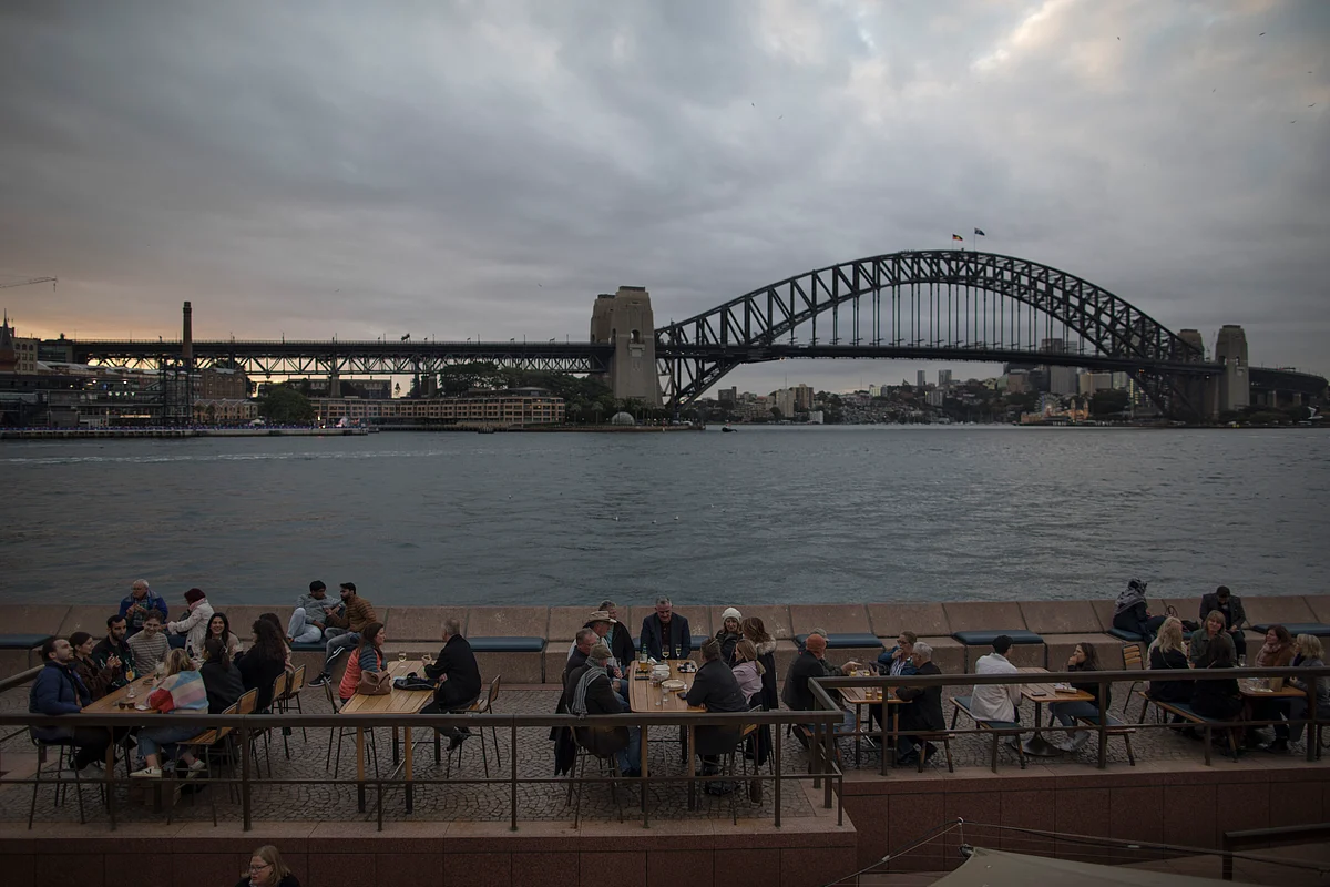 Diners at a restaurant near Sydney Harbour Bridge on Saturday, May 27, 2023. Photographer: Brent Lewin/Bloomberg