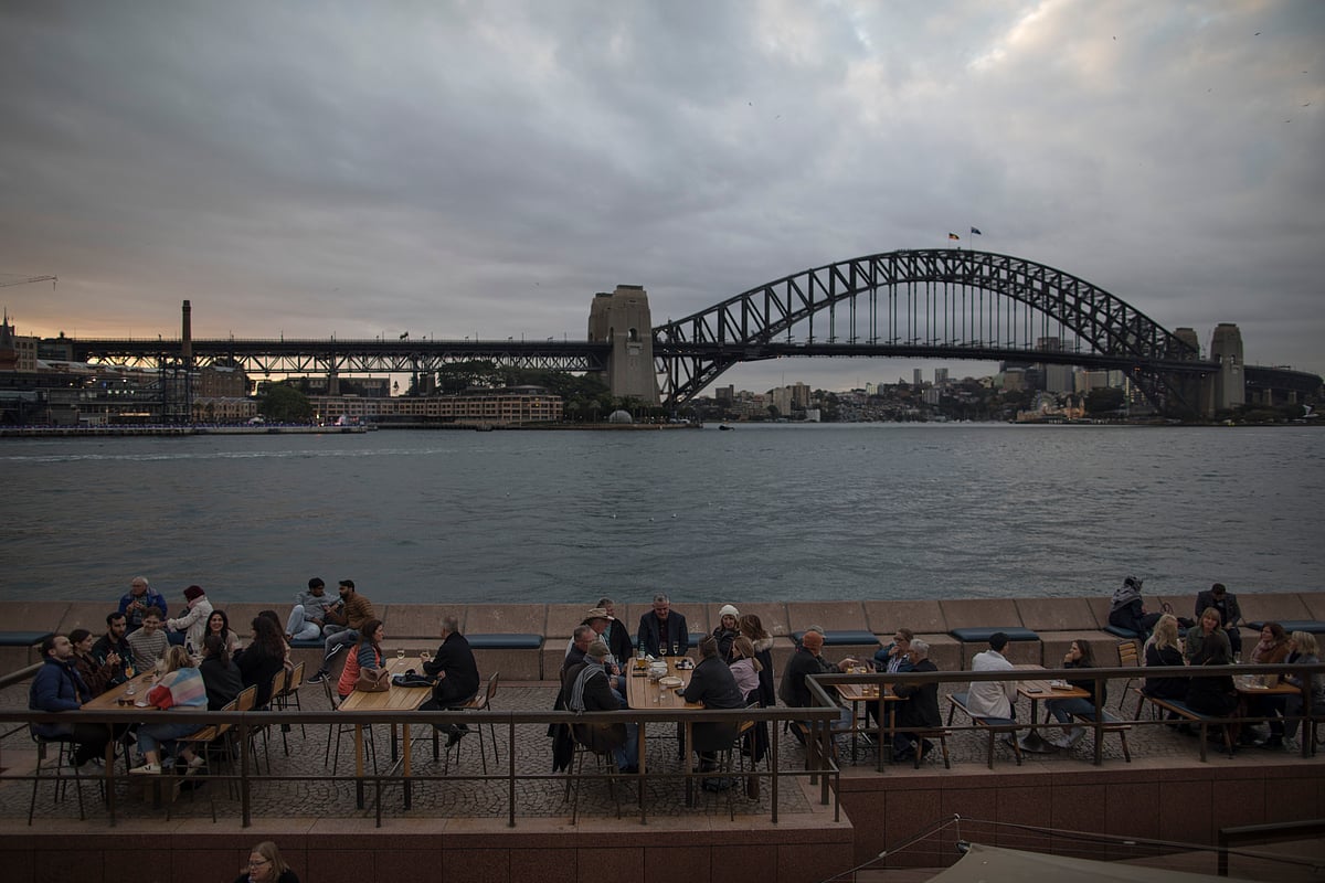 Diners at a restaurant near Sydney Harbour Bridge on Saturday, May 27, 2023. Photographer: Brent Lewin/Bloomberg