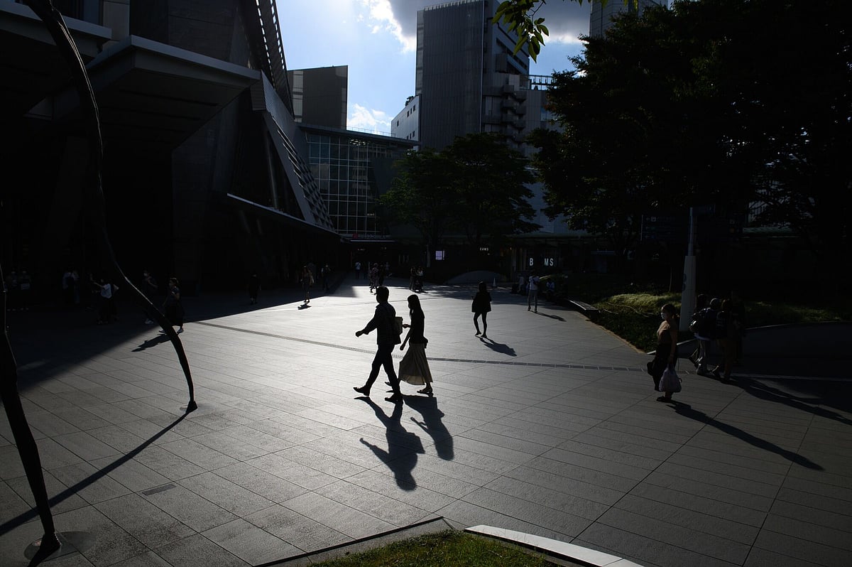 <div class="paragraphs"><p>Silhouetted pedestrians near the Roppongi Hills complex in Tokyo, Japan. (Photographer: Akio Kon/Bloomberg)</p></div>