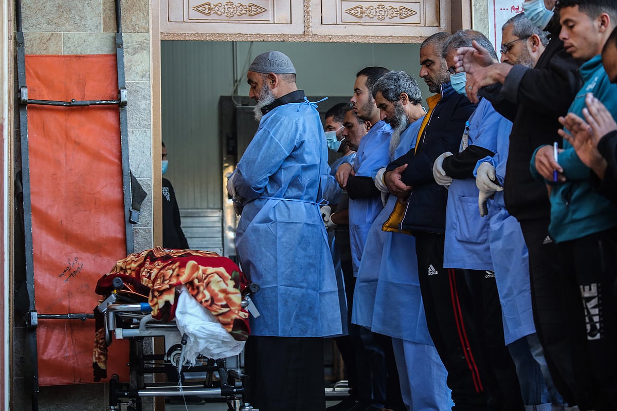 Palestinians mourn as they collect the bodies of those killed in an airstrike in Khan Younis on Dec. 3.Photographer: Ahmad Hasaballah/Getty Images