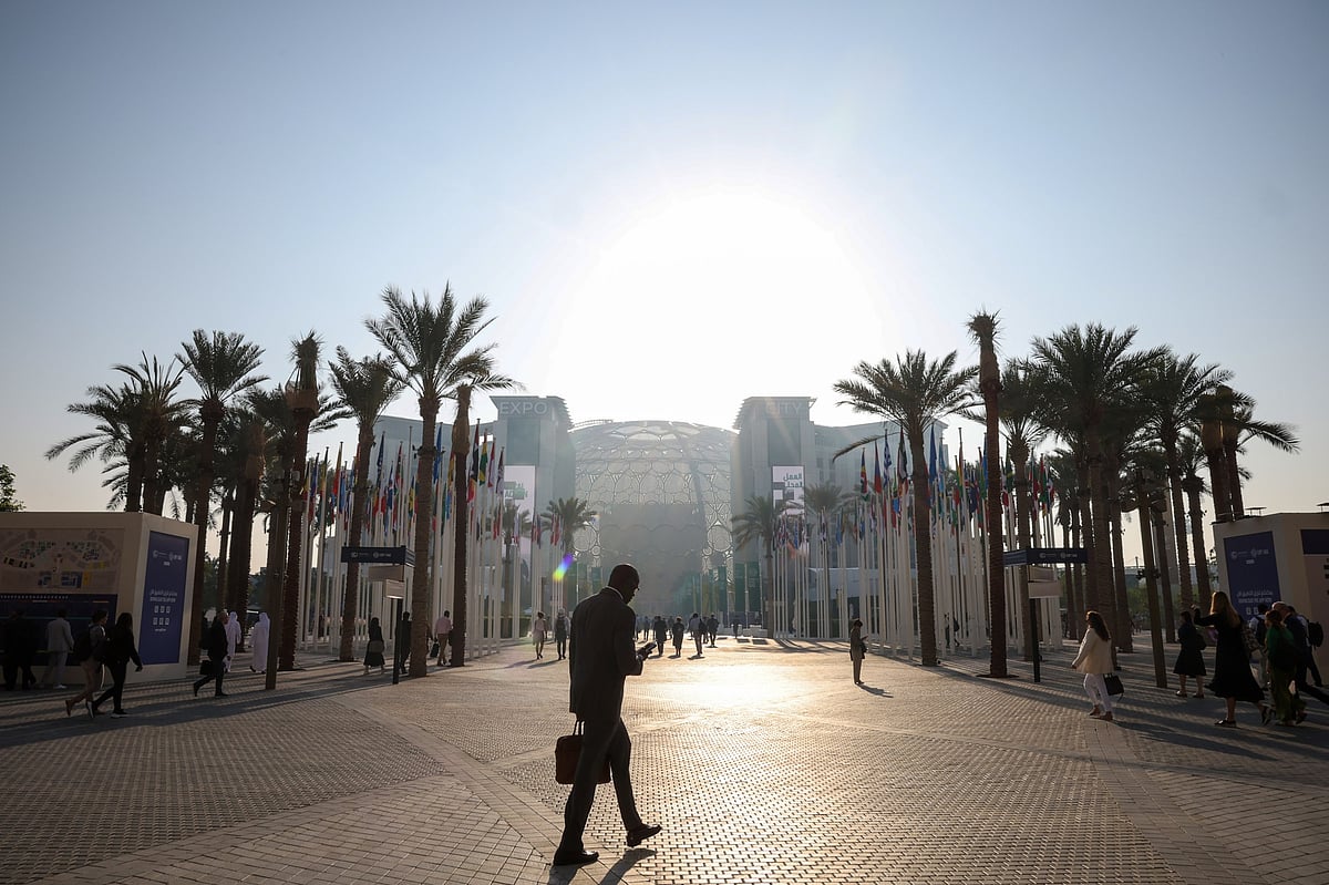 Attendees arrive at the Blue Zone at the COP28 climate conference at Expo City in Dubai, United Arab Emirates, on Dec. 2.Photographer: Annie Sakkab/Bloomberg