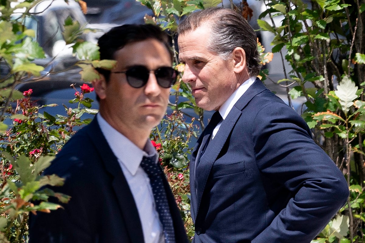Hunter Biden, right, exits federal court in Wilmington, Delaware, on July 26.Photographer: Hannah Beier/Bloomberg
