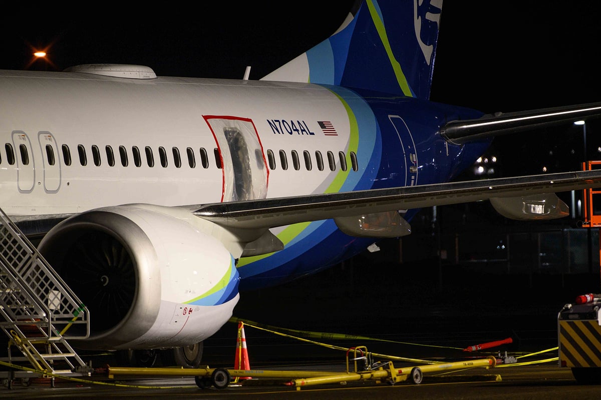 A plastic sheet covers an area of the fuselage of the Alaska Airlinee Boeing 737 MAX 9 aircraft at Portland International Airport on Jan. 8.Photographer: Mathieu Lewis-Rolland/Getty Images