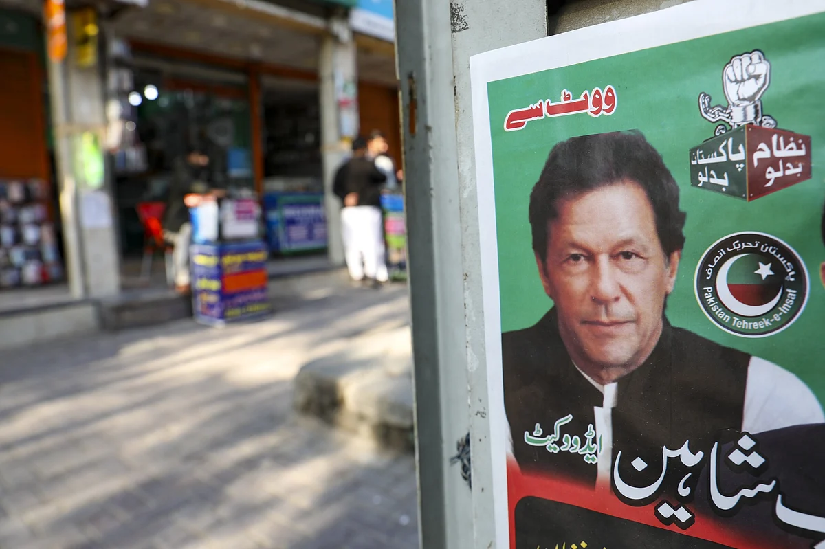 An election campaign poster with Imran Khan in Islamabad on Feb. 7.Photographer: Asad Zaidi/Bloomberg