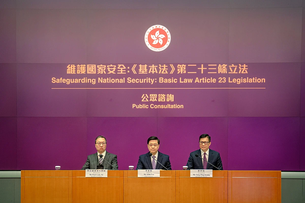 John Lee, center, at a news conference in Hong Kong on Jan. 30.Photographer: Leung Man Hei/Bloomberg