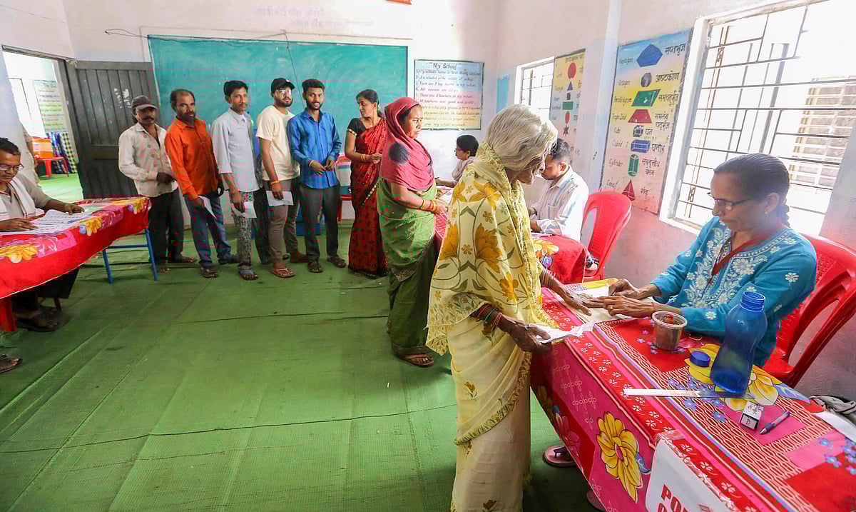 <div class="paragraphs"><p>Chhindwara: Voters go through the election procedure to cast their votes for the first phase of voting for Lok Sabha elections, in Chhindwara, Madhya Pradesh, Friday, April 19, 2024. (PTI Photo)</p></div>