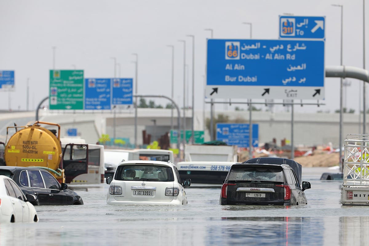 Abandoned vehicles on a flooded highway.Photographer: Christopher Pike/Bloomberg