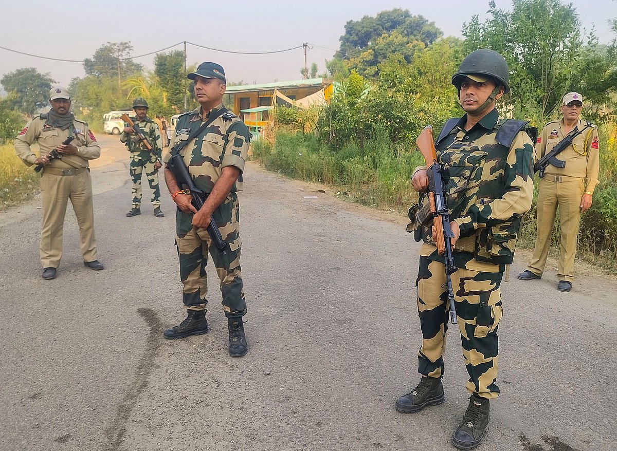 <div class="paragraphs"><p>Border Security Force and police personnel stand guard. (Source: PTI Photo)</p></div>