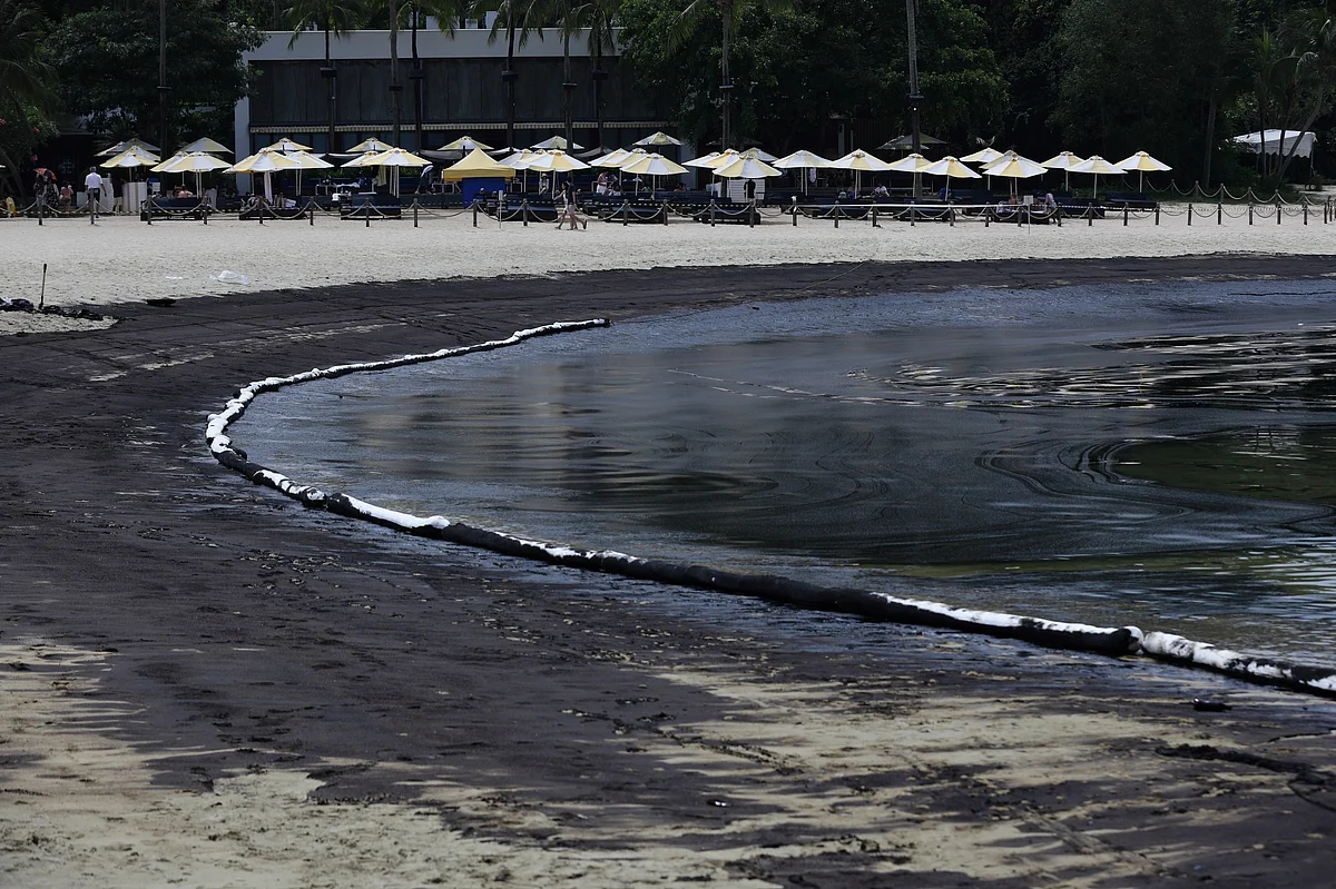 Oil coated sand along the Tanjong beach on Sentosa Island on June 15.Photographer: Suhaimi Abdullah/Bloomberg