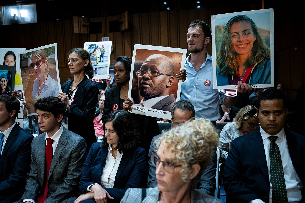 Relatives of Boeing airplane crash victims hold images prior to a Senate Homeland Security and Governmental Affairs Permanent Subcommittee on Investigations hearing in Washington, DC on June 18.Photographer: Graeme Sloan/Bloomberg