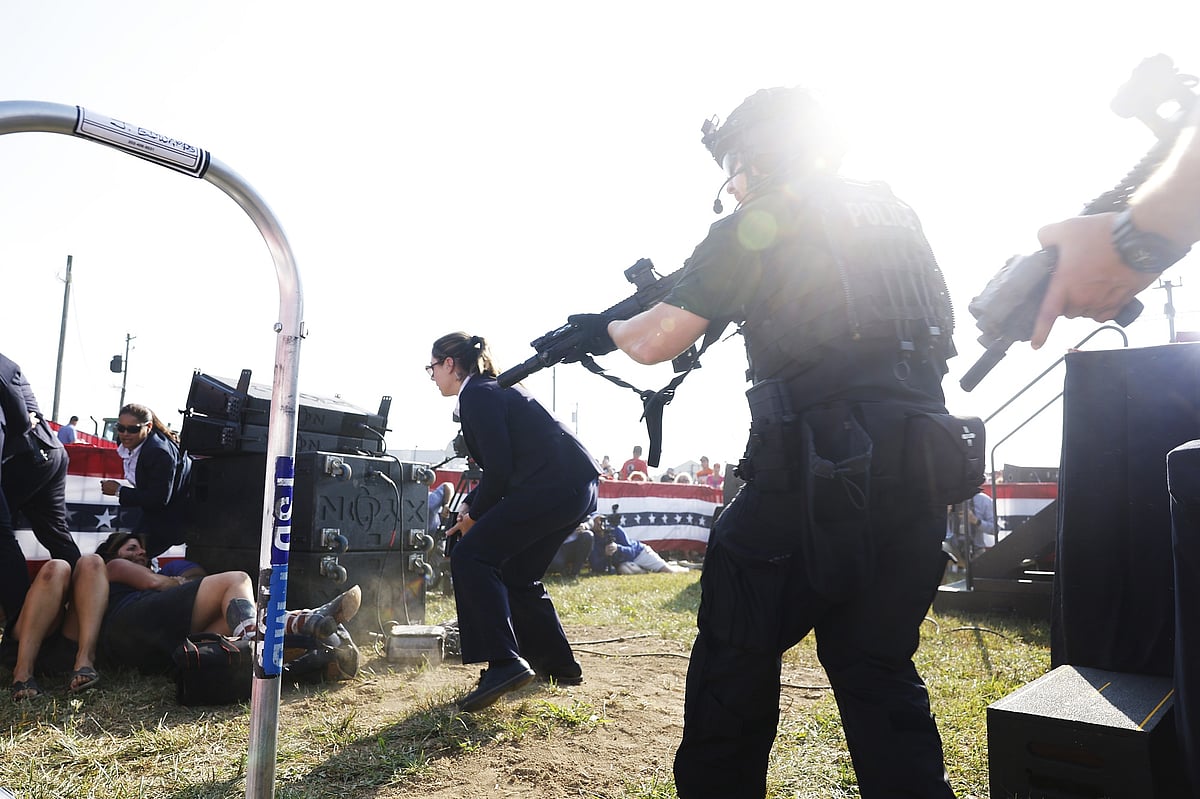 Law enforcement react after shots were fired.Photographer: Anna Moneymaker/Getty Images 