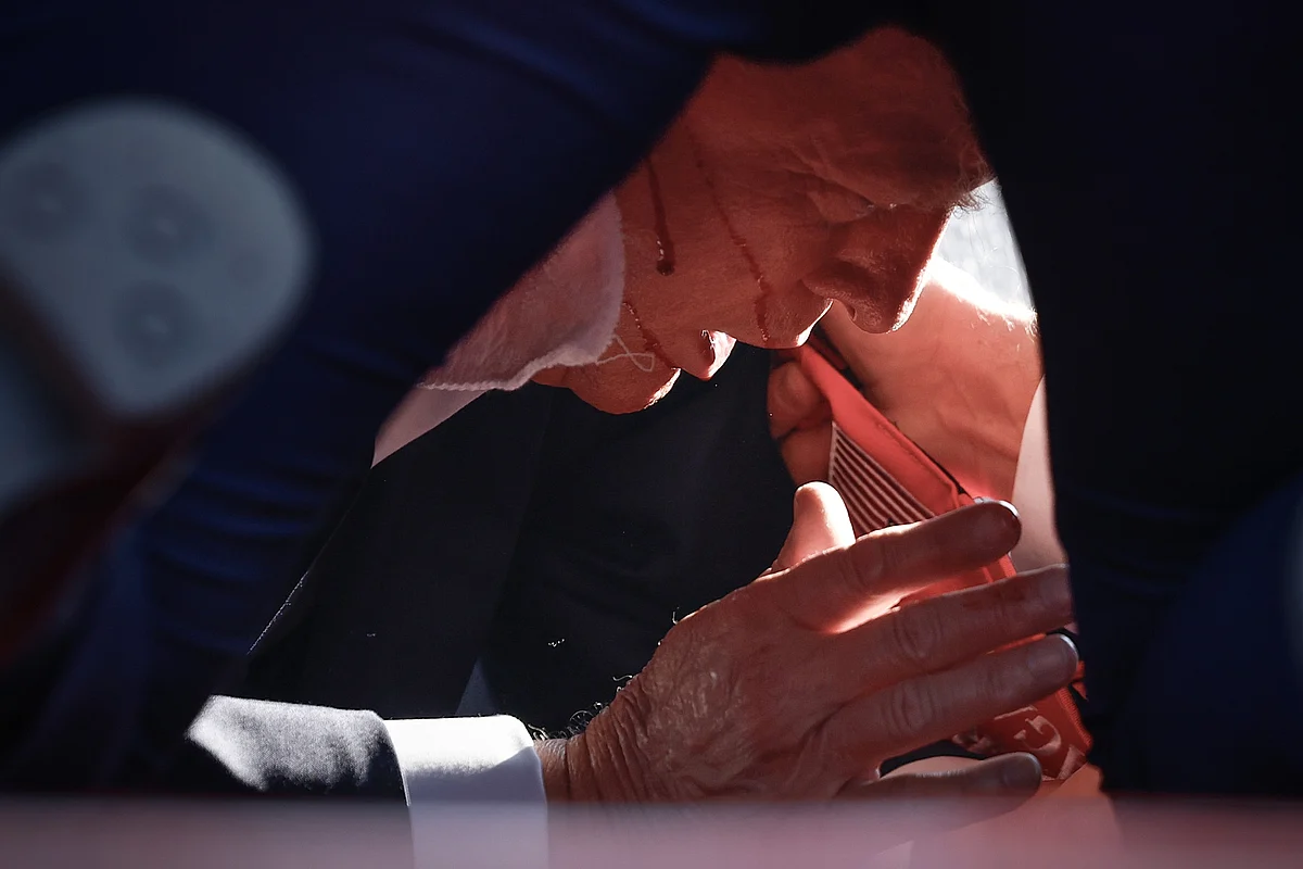 Republican presidential candidate former President Donald Trump is shown covered by U.S. Secret Service agents.Photographer: Anna Moneymaker/Getty Images