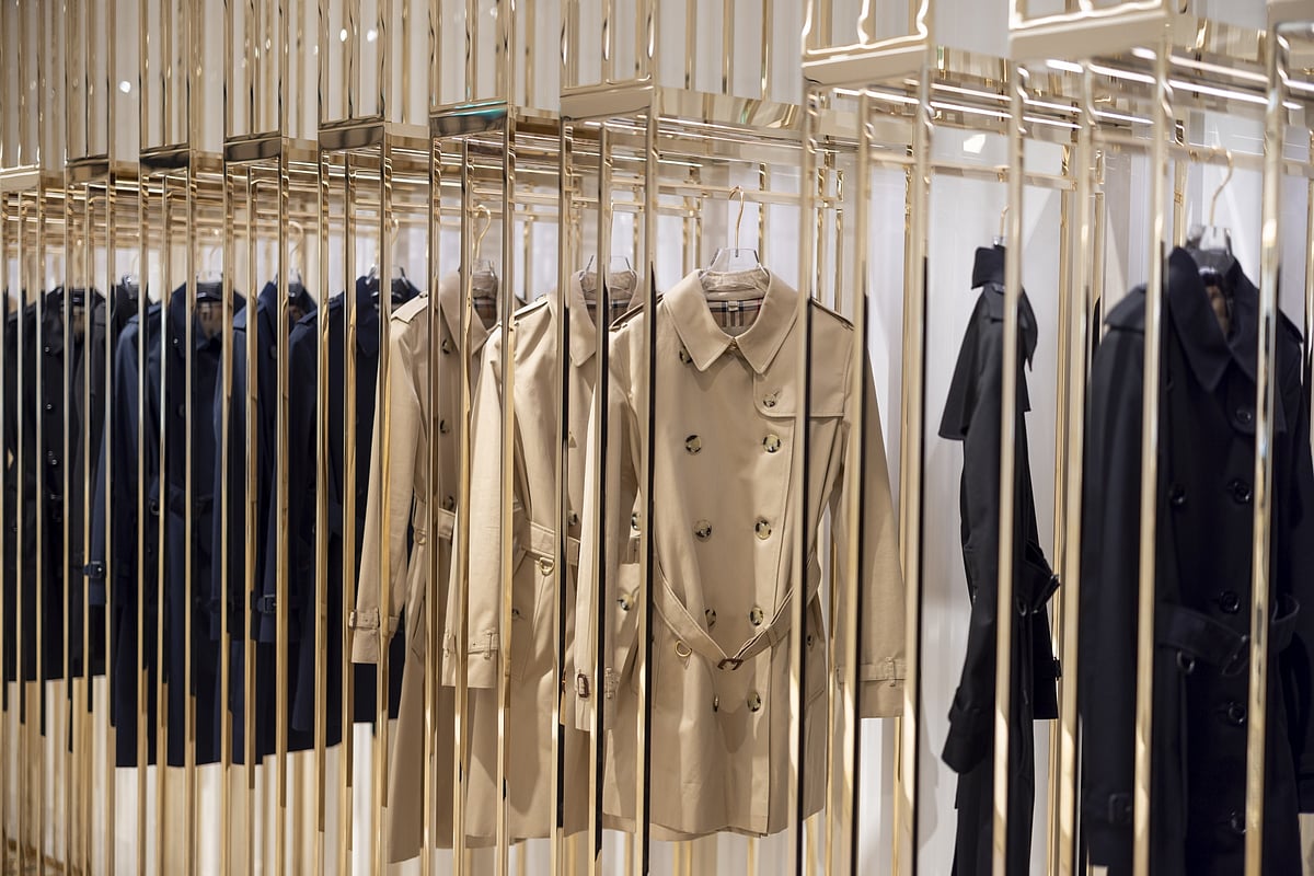 Trench coats on display in a Burberry Group store on Bond Street in London, UK.