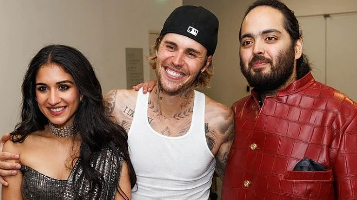 <div class="paragraphs"><p>Radhika Merchant and husband Anant Ambani, photographed with singer Justin Bieber who was a guest at their wedding. (Photo source: @justinbieber via X)</p></div>