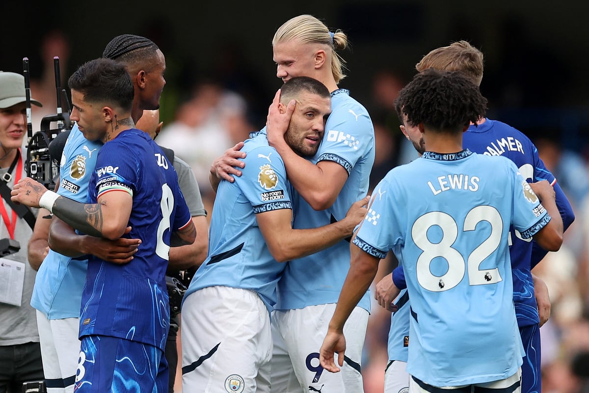 Mateo Kovacic is hugged by teammate Erling Haaland after Manchester City beat Chelsea last weekend.Photographer: Catherine Ivill/AMA/Getty Images