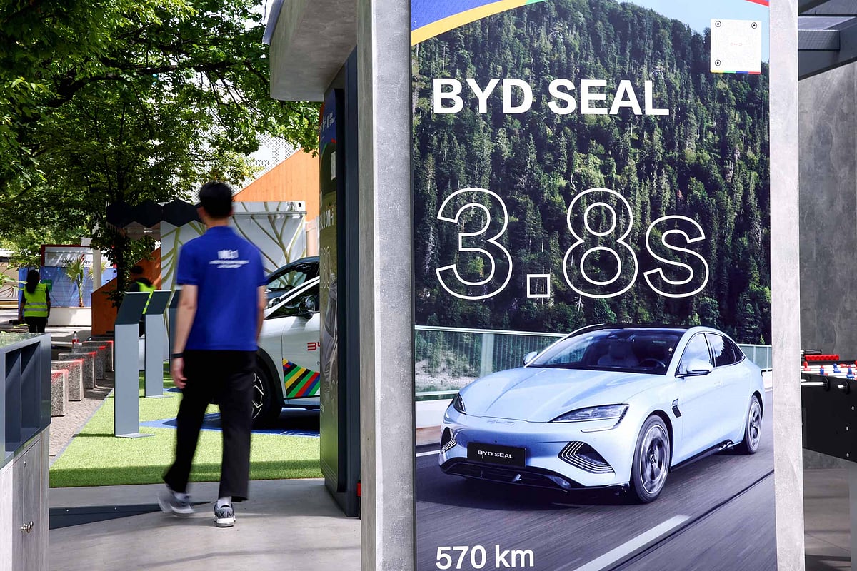 Electric vehicles on display at a BYD Co. sponsorship stand at a Fan Zone during Europe’s soccer championships in Germany earlier this year. Photographer: Liesa Johannssen/Bloomberg