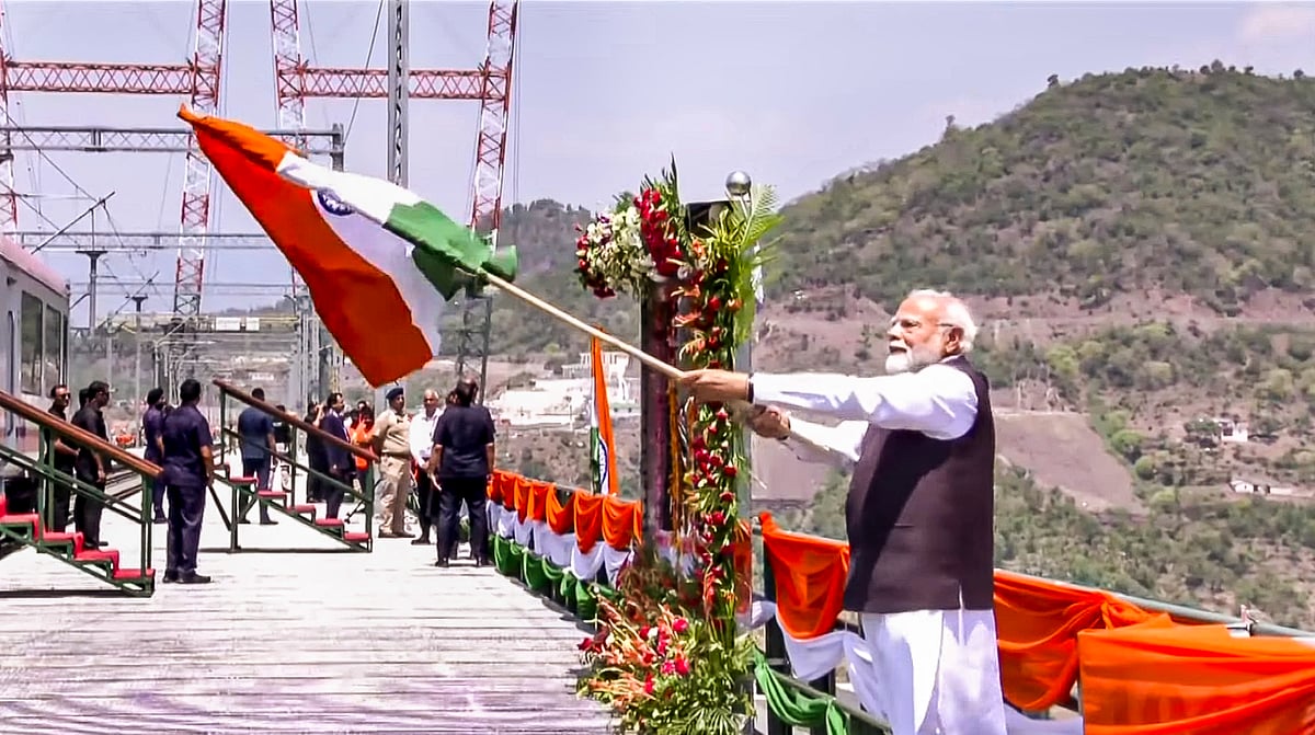 <div class="paragraphs"><p>Prime Minister Narendra Modi waves the national flag after inauguration of the Chenab Bridge, the world's highest railway arch bridge, in Reasi district, Jammu &amp; Kashmir, Friday, June 6, 2025. (Photo Source:  screengrab via YT/@narendramodi)</p></div>