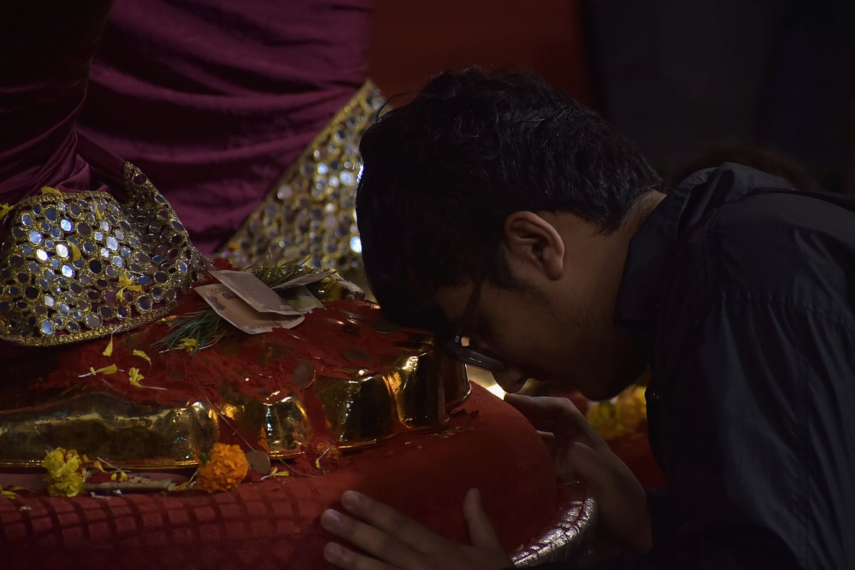 <div class="paragraphs"><p>Devotees come from across the country to surrender their love and pay respect at the feet of Lord Ganesha. (Photo By: Divya Prata)</p></div>