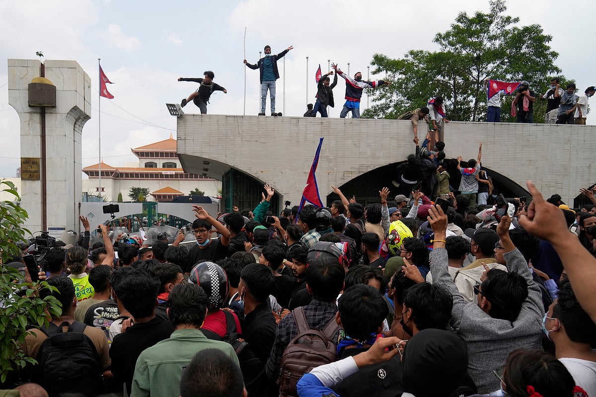 <div class="paragraphs"><p>Protesters shout slogans as they gather outside the Parliament building in Kathmandu, Nepal. (Photo: AP via PTI)</p></div>