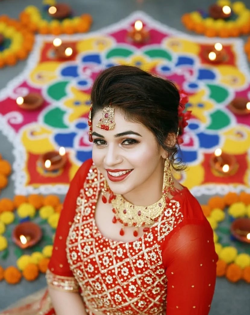 <div class="paragraphs"><p>Portrait of a woman with Diwali decor, created by Google Gemini.</p></div>