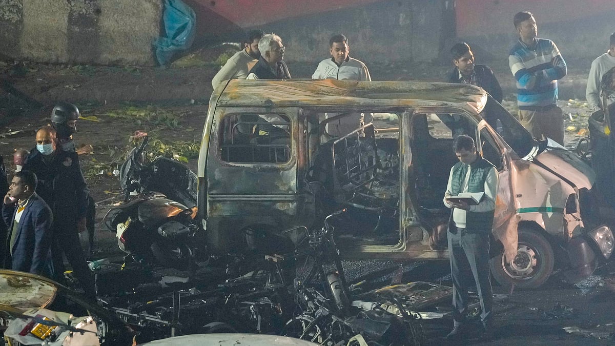 <div class="paragraphs"><p>Officers from various security agencies investigate the spot after a blast occurred in a parked car near Red Fort, leaving multiple vehicles in flames, in New Delhi on Monday, Nov. 10, 2025. (Photo: PTI)</p></div>