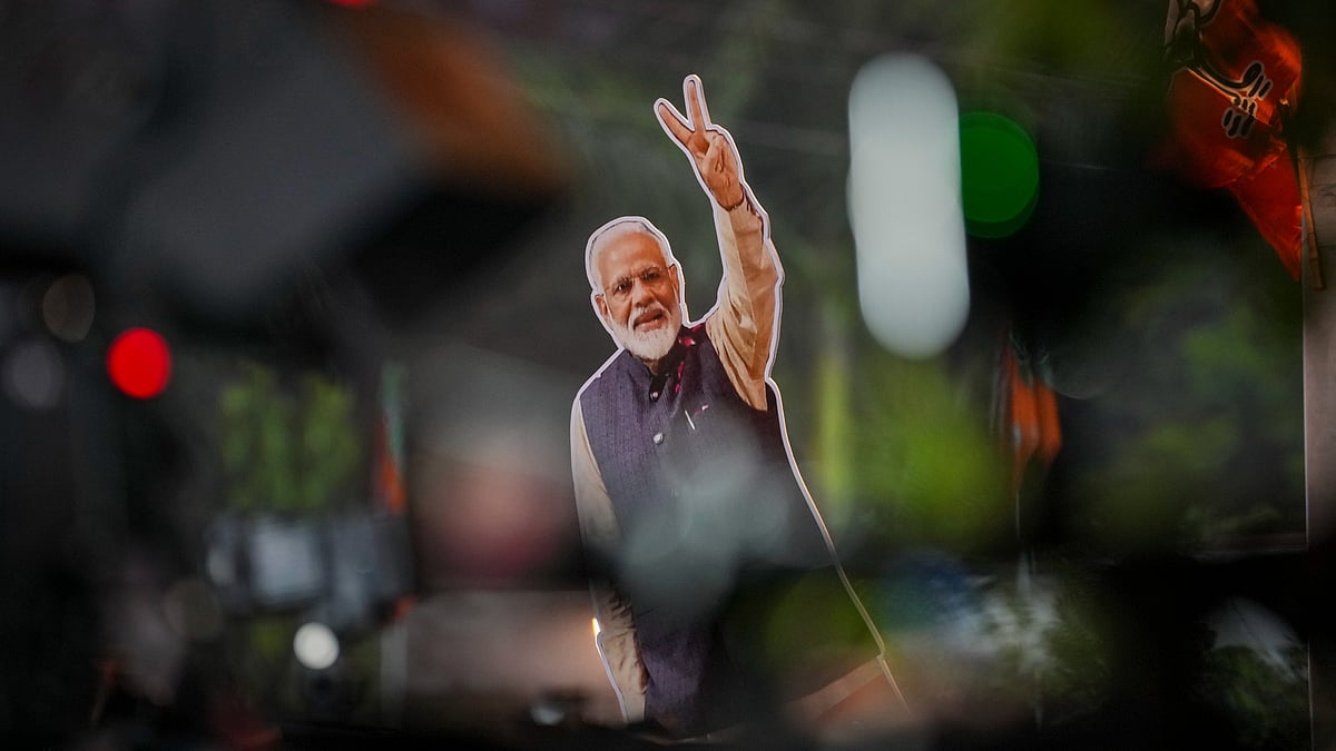 <div class="paragraphs"><p>New Delhi: A cut-out of Prime Minister Narendra Modi is displayed during celebrations following the NDA's victory in the Bihar Assembly elections, at the BJP Headquarters, in New Delhi, Friday, Nov. 14, 2025. (PTI Photo/Karma Bhutia)</p></div>