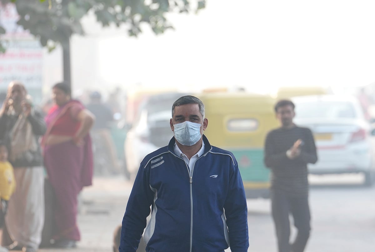 <div class="paragraphs"><p>A man wears a mask amid smog as the Air Quality Index (AQI) remains in the poor category, near ISBT in New Delhi. (Photo:&nbsp;Kamal Kishore/PTI)</p></div>