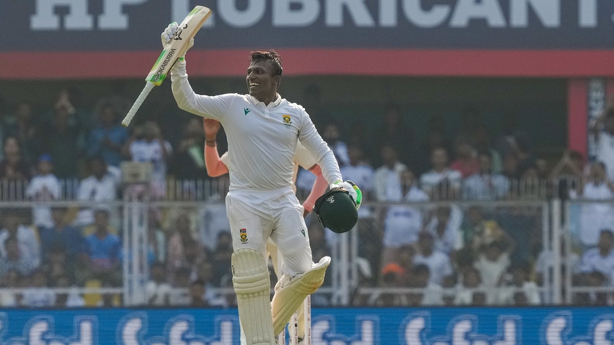 <div class="paragraphs"><p>Guwahati: South Africa's Senuran Muthusamy celebrates his century during day two of the second Test cricket match of a series between India and South Africa, at ACA Stadium in Guwahati, Sunday, Nov. 23, 2025. (PTI Photo/Shahbaz Khan) </p></div>