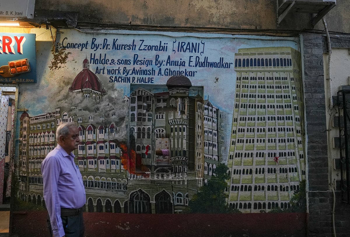 <div class="paragraphs"><p>A man walks past a mural depicting the Taj Mahal Palace hotel, left, and Trident hotel, the sites of the 2008 Mumbai terror attacks, on the eve of the anniversary of the gruesome incident, in Mumbai. (Photo: Kunal Patil/PTI)</p></div>