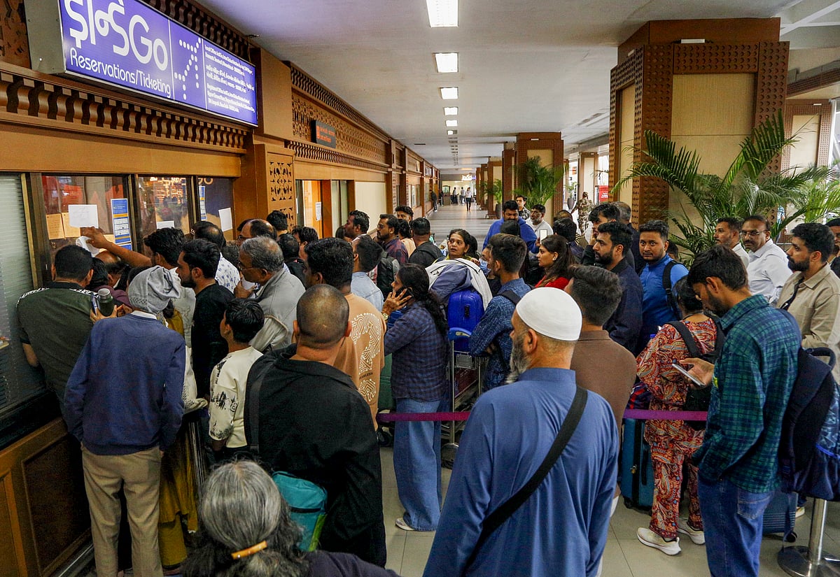 <div class="paragraphs"><p>Stranded passengers queue up near the IndiGo airlines counter at Sardar Vallabhbhai Patel International Airport amid flight disruptions, in Ahmedabad on&nbsp; Friday, Dec. 5, 2025. (Photo: PTI)</p></div>