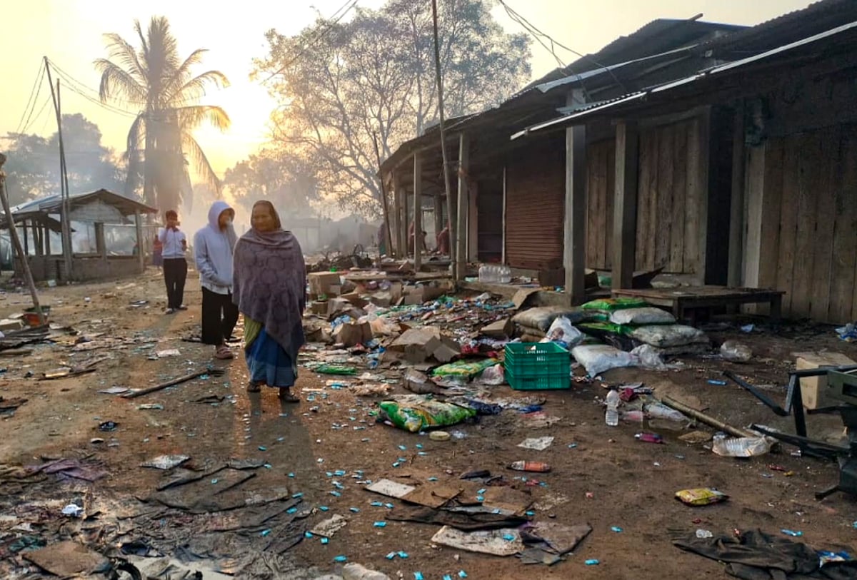 <div class="paragraphs"><p>People at a vandalised area following violent protests demanding eviction of encroachers from tribal belts, at Kheroni, in Karbi Anglong district, Assam, Wednesday, Dec. 24, 2025. (Photo: PTI)</p></div>