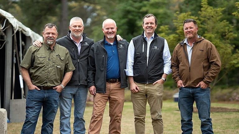 <div class="paragraphs"><p>Graham Walker (second to the right) with Fibrebond team. (Image: Company Website)</p></div>