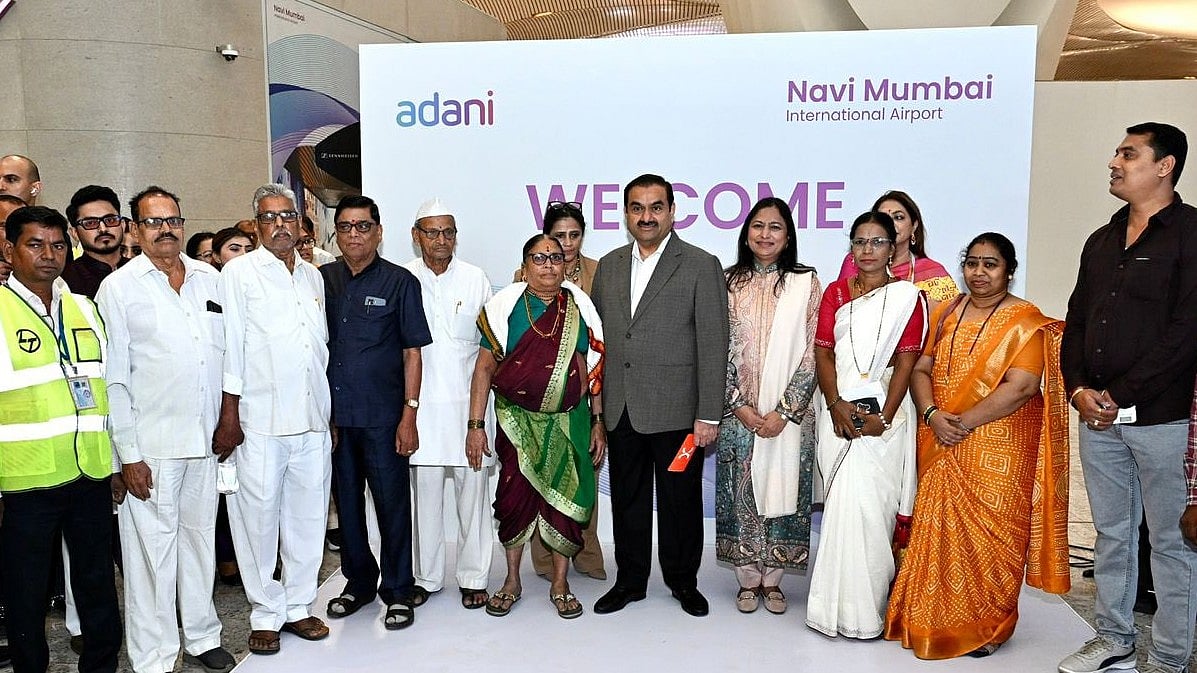 <div class="paragraphs"><p>Gautam Adani personally welcomed passengers from the inaugural flight and interacted with airport staff, frontline workers and first-time flyers. (Photo: Gautam Adani/X)</p></div>